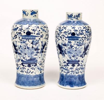 Appraisal: A pair of th Century Chinese vases decorated boys supporting