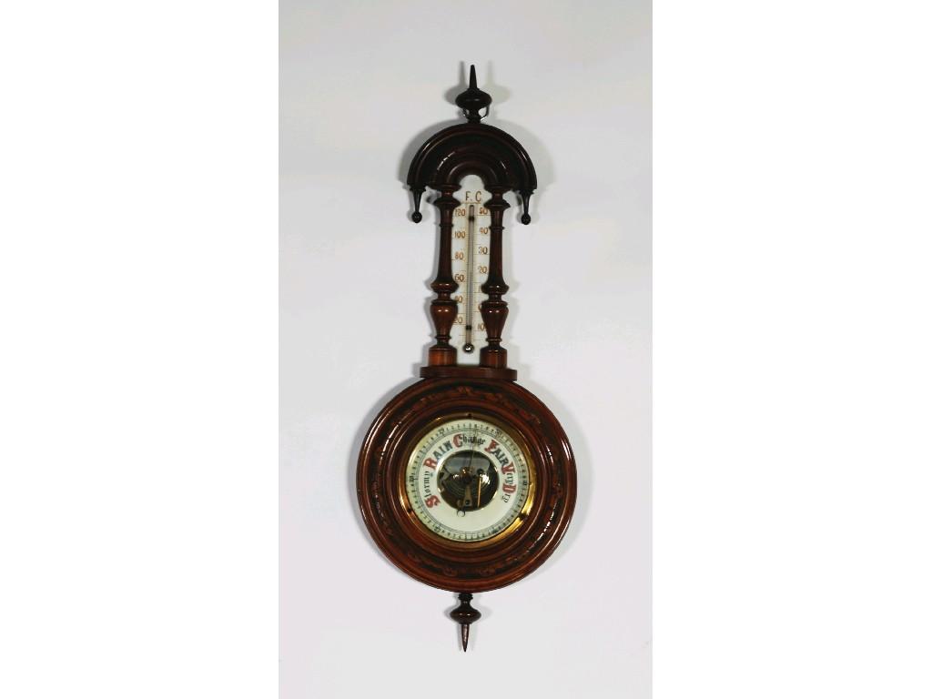 Appraisal: EARLY TWENTIETH CENTURY CARVED WALNUTWOOD CASE ANEROID BAROMETER AND THERMOMETER