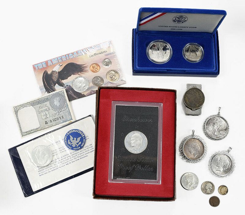 Appraisal: Assorted Coins dated Morgan Silver Dollar encased in money clip