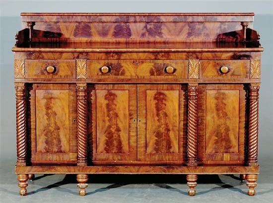 Appraisal: American Classical carved mahogany buffet circa backsplash supported on Ionic