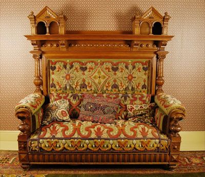 Appraisal: A late nineteenth century oak architectural high backed settee probably