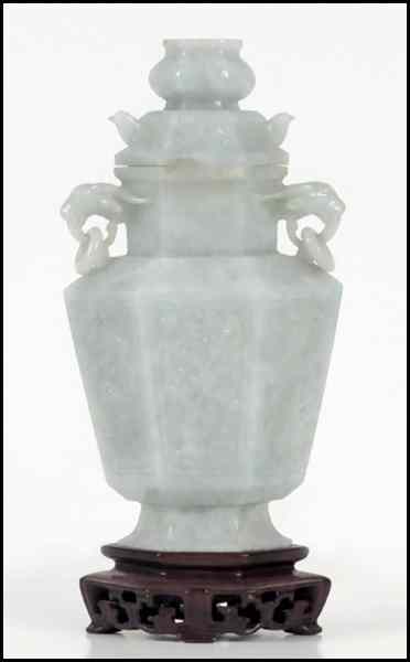 Appraisal: CHINESE CARVED JADE URN Raised on a '' carved wood