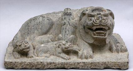 Appraisal: MING-STYLE CARVED GREY STONE ANIMAL GROUP Carved as a recumbent