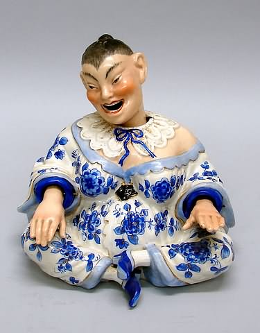 Appraisal: Seated lady in blue and white dress nodding head movable