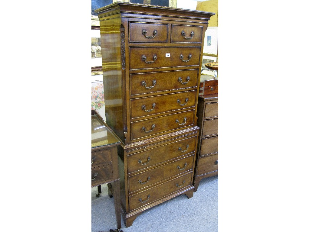 Appraisal: Georgian style mahogany tallboy with canted corner and brushing slide