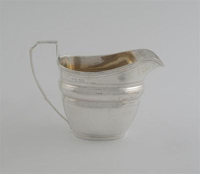 Appraisal: A George III cream jug with a reeded rim and