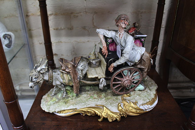 Appraisal: A CONTINENTAL PORCELAIN FIGURE of an organ grinder with donkey