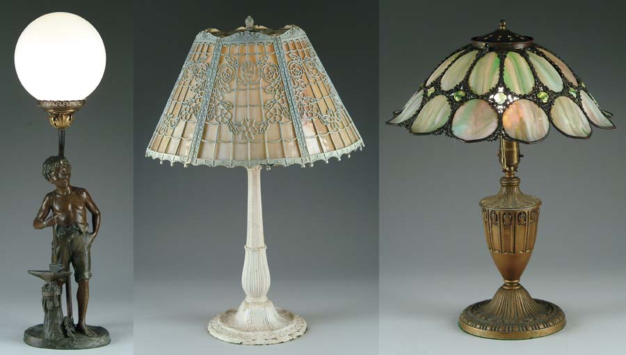 Appraisal: THREE TABLE LAMPS Metal overlay frame has wreaths of open