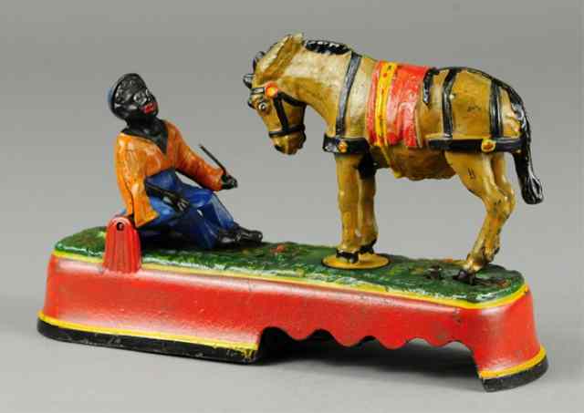 Appraisal: a SPISE A MULE BENCH MECHANICAL BANK WITH BOX Orange