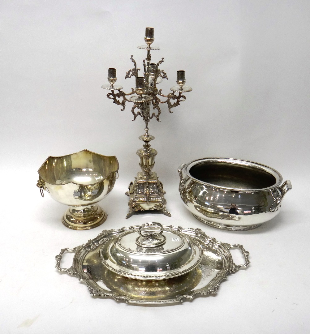 Appraisal: Plated wares comprising a five light table candelabra a shaped