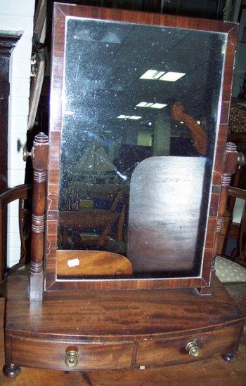 Appraisal: A William IV mahogany two-drawer box mirror with rectangular glass