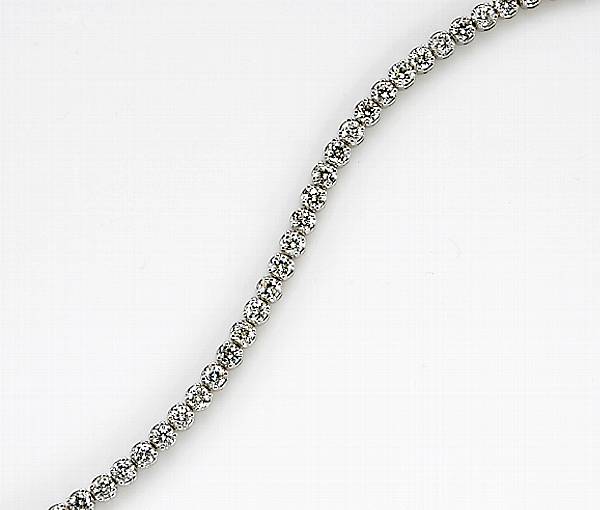 Appraisal: A diamond and fourteen karat white gold line bracelet estimated