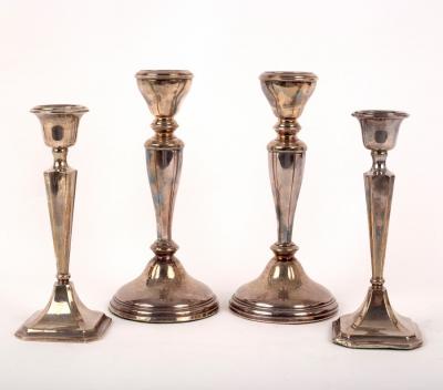 Appraisal: A pair of silver candlesticks Birmingham weighted cm high and