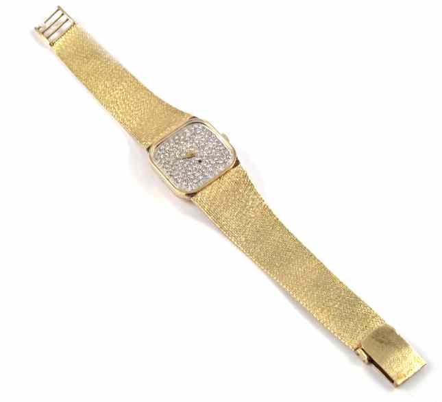 Appraisal: MAN'S DIAMOND AND FOURTEEN KARAT GOLD WRISTWATCH having a Swiss