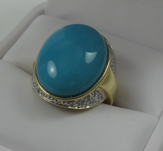 Appraisal: TURQUOISE DIAMOND AND FOURTEEN KARAT GOLD RING set with an