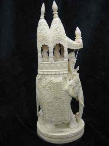 Appraisal: Carved Ivory Figurine of Elephant inparade dress with riders elaborate