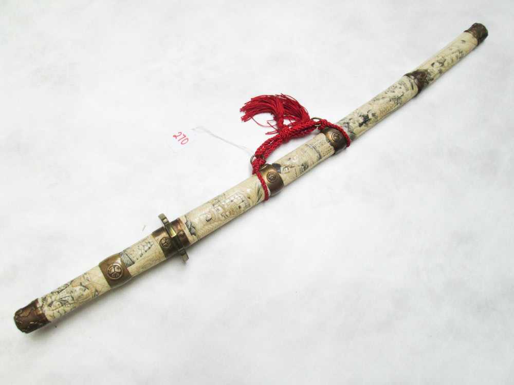 Appraisal: JAPANESE STYLE SWORD blade fitted in a carved bone grip