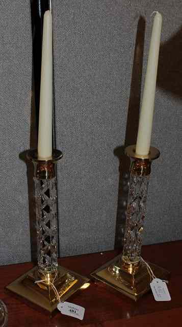 Appraisal: A PAIR OF WATERFORD CRYSTAL STEMMED AND BRASS MOUNTED CANDLESTICKS