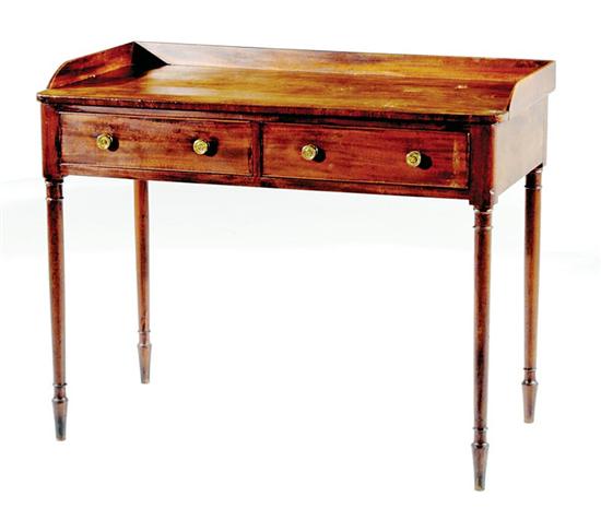 Appraisal: Regency mahogany dressing table first half th century three-quarter gallery