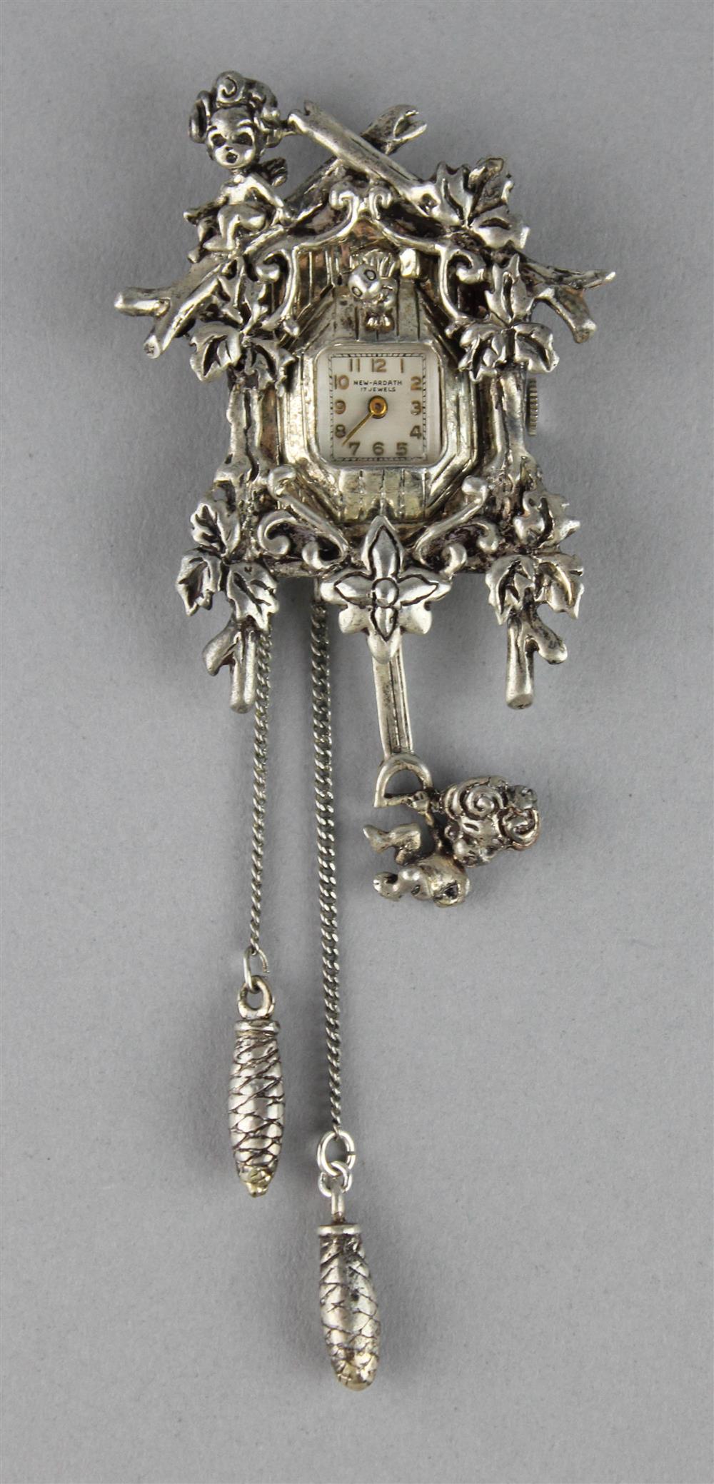 Appraisal: CUCKOO CLOCK WATCH BROOCH a figural cuckoo clock brooch with