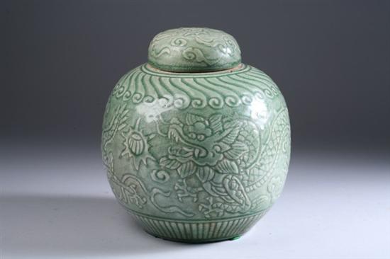 Appraisal: THAI GREEN PORCELAIN JAR AND COVER Incised with dragon chasing