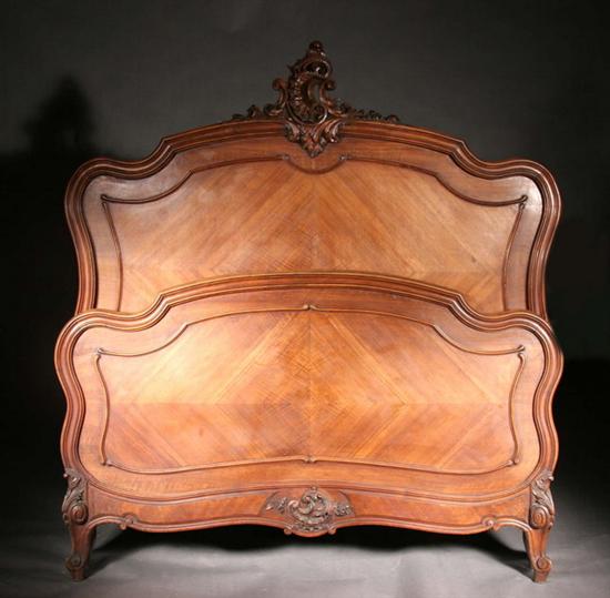 Appraisal: FRENCH WALNUT FULL-SIZE BED th century without rails Headboard has