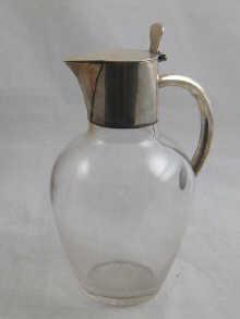 Appraisal: A silver mounted glass claret jug with cut glass base