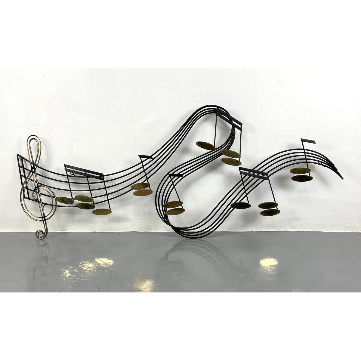 Appraisal: C JERE musical notes metal wall sculpture Signed Dimensions H