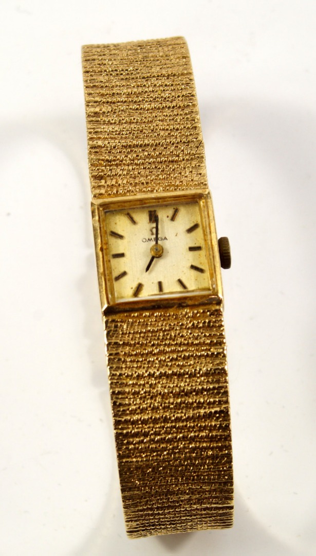 Appraisal: An Omega lady's ct gold wristwatch square dial gold batons