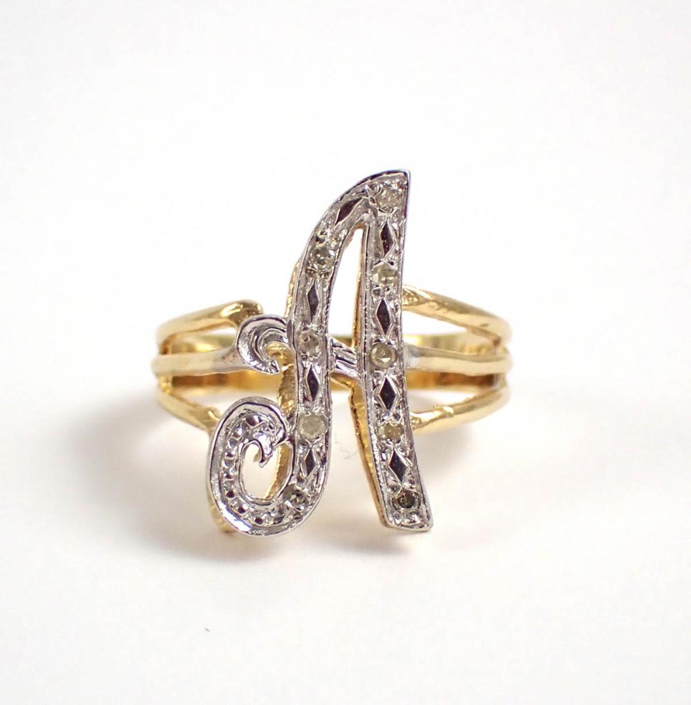 Appraisal: DIAMOND AND FOURTEEN KARAT YELLOW AND WHITE GOLD SPLIT SHANK