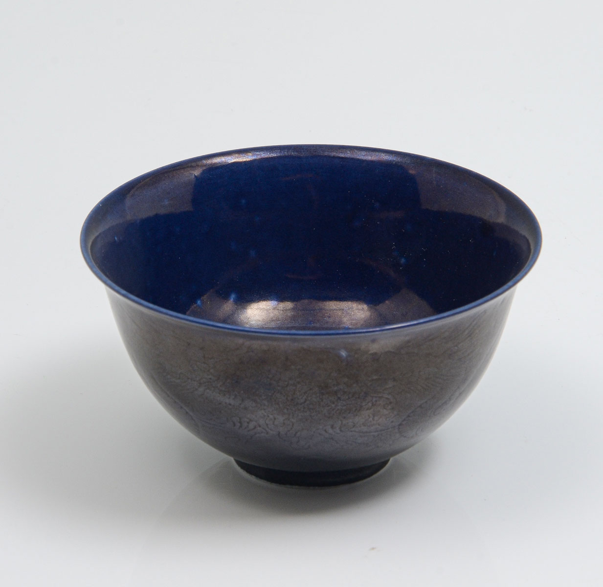 Appraisal: BLUE GLAZED CHINESE DRAGON BOWL Cobalt blue glazed Chinese porcelain