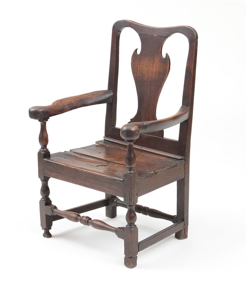 Appraisal: PROVINCIAL QUEEN ANNE OAK ARMCHAIR With a baluster-shaped backsplat and