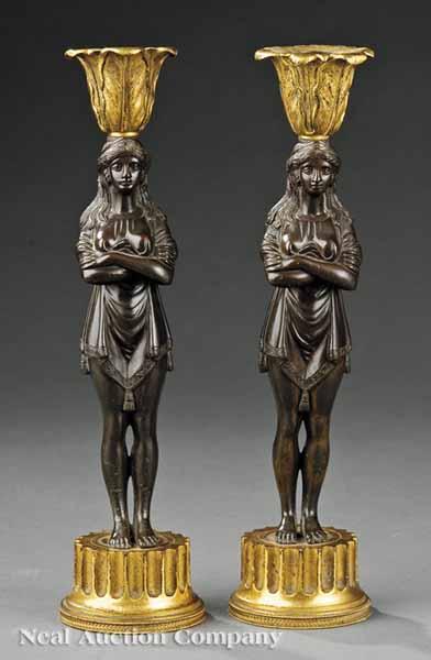 Appraisal: A Pair of Regency Bronze and Ormolu Candlesticks in the