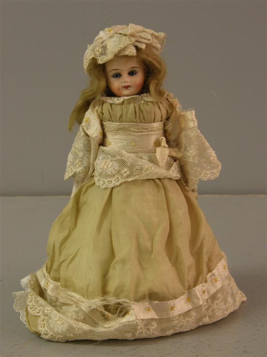 Appraisal: th century girl doll with blue eyes and closed mouth