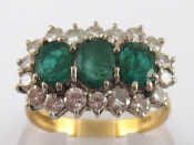 Appraisal: An carat gold emerald and diamond ring largest emerald approx