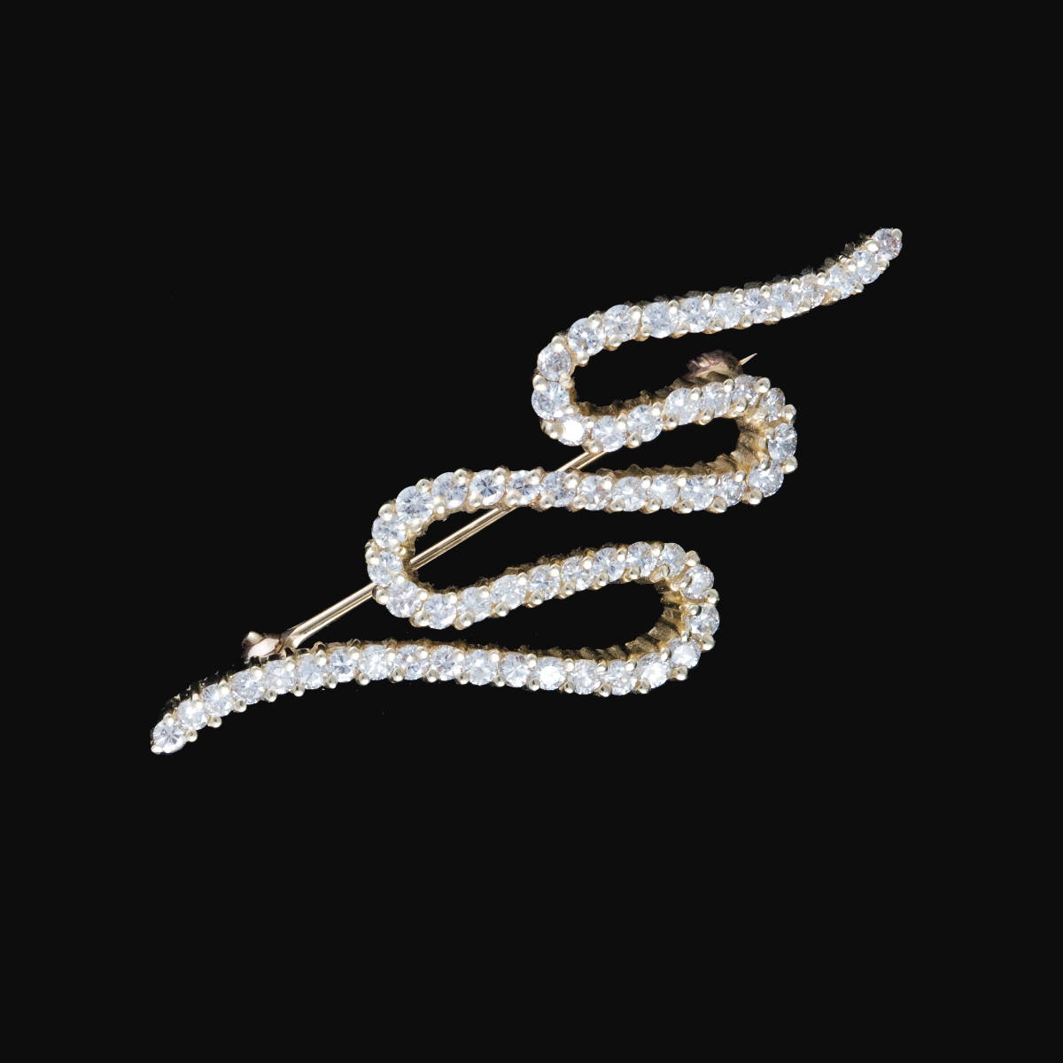 Appraisal: DIAMOND SQUIGGLE BROOCH Set with approximately small diamonds length inches