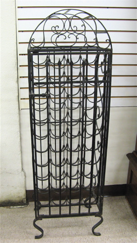 Appraisal: WROUGHT IRON FLOOR WINE RACK with space for bottles visible