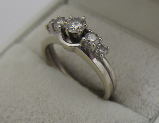 Appraisal: DIAMOND AND K WHITE GOLD RING centering a round brilliant-cut