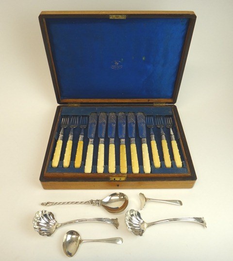 Appraisal: Silver flatware comprising a pair of sauce ladles with scallop