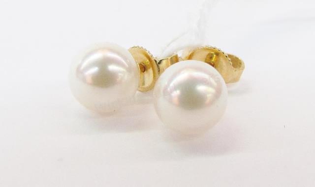 Appraisal: A pair of Mikimoto pearl earrings each with single mm