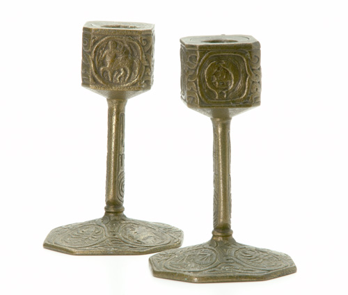 Appraisal: TIFFANY STUDIOS Pair of desk candlesticks in the Zodiac pattern