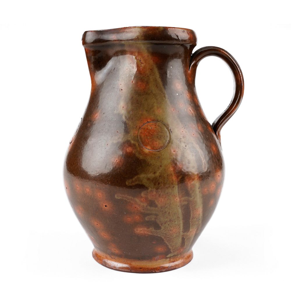 Appraisal: th c Pennsylvania Redware Pitcher th century Pennsylvania redware pitcher