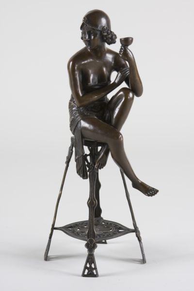 Appraisal: Bronze after J E Mir of Art Deco Seated Flapper