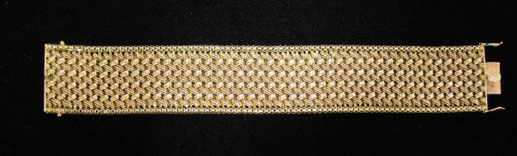 Appraisal: AN CT YELLOW GOLD CUFF BRACELET the rope-twist and plain-links