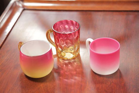 Appraisal: THREE ART GLASS PUNCH CUPS A shiny Wheeling Peachblow cup