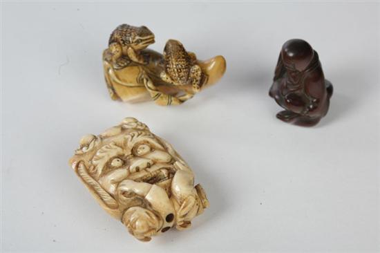 Appraisal: THREE SMALL CARVINGS Japanese th century Ivory netsuke of a