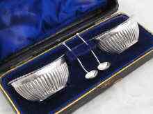 Appraisal: A boxed pair of silver boat shaped salts with matching