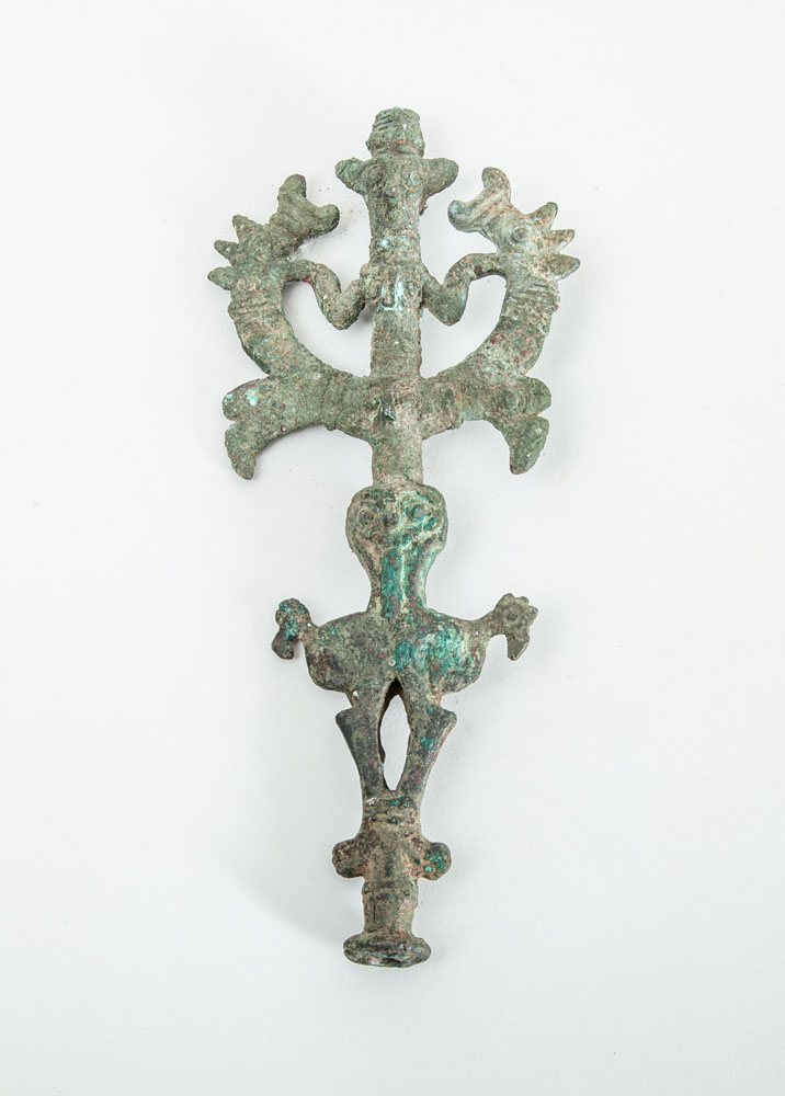 Appraisal: LURISTAN BRONZE FINIAL The totemic stem with two figures flanked