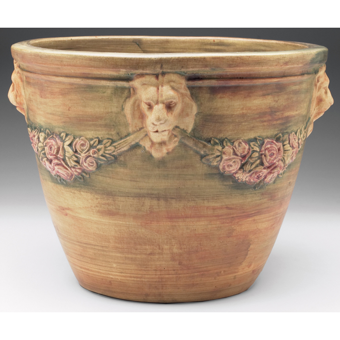 Appraisal: Weller jardiniere lion heads and roses impressed mark ''w x