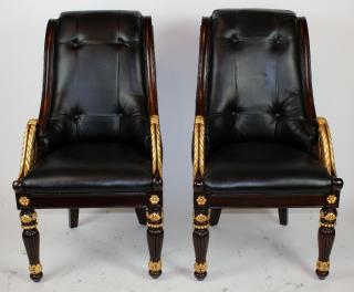 Appraisal: Pair of carved mahogany leather library chairs A pair of